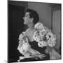 Model Wearing a Flowery Dress While Peering Into the Distance-Nina Leen-Mounted Photographic Print