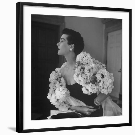 Model Wearing a Flowery Dress While Peering Into the Distance-Nina Leen-Framed Photographic Print