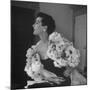 Model Wearing a Flowery Dress While Peering Into the Distance-Nina Leen-Mounted Photographic Print