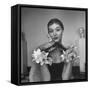 Model Wearing a Flowery Glove While Peering Into the Distance-Nina Leen-Framed Stretched Canvas