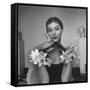 Model Wearing a Flowery Glove While Peering Into the Distance-Nina Leen-Framed Stretched Canvas