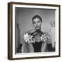 Model Wearing a Flowery Glove While Peering Into the Distance-Nina Leen-Framed Photographic Print