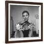 Model Wearing a Flowery Glove While Peering Into the Distance-Nina Leen-Framed Photographic Print