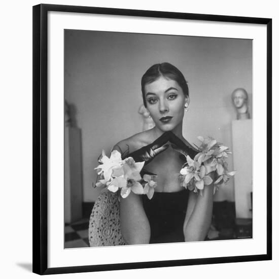 Model Wearing a Flowery Glove While Peering Into the Distance-Nina Leen-Framed Photographic Print