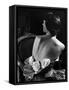 Model Wearing Mother of Pearl Satin Gown with roses tucked in waist by Balmain-Nina Leen-Framed Stretched Canvas