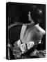 Model Wearing Mother of Pearl Satin Gown with roses tucked in waist by Balmain-Nina Leen-Stretched Canvas