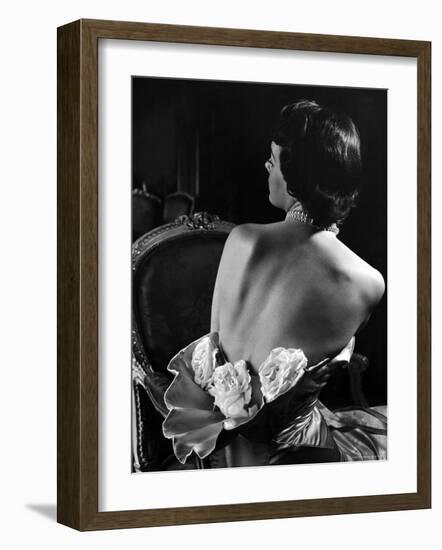 Model Wearing Mother of Pearl Satin Gown with roses tucked in waist by Balmain-Nina Leen-Framed Photographic Print