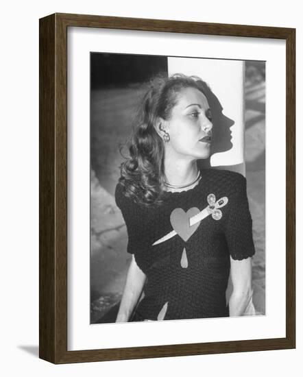 Model Wearing Sweater with Heart Pierced by Jeweled Dagger-Nina Leen-Framed Photographic Print