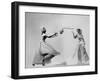 Model Wearing Wedding Gown Tossing Bouquet to Another Model Dresses as Bridesmaid-Gjon Mili-Framed Photographic Print