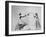 Model Wearing Wedding Gown Tossing Bouquet to Another Model Dresses as Bridesmaid-Gjon Mili-Framed Photographic Print