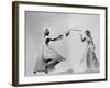 Model Wearing Wedding Gown Tossing Bouquet to Another Model Dresses as Bridesmaid-Gjon Mili-Framed Photographic Print