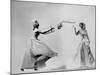 Model Wearing Wedding Gown Tossing Bouquet to Another Model Dresses as Bridesmaid-Gjon Mili-Mounted Photographic Print
