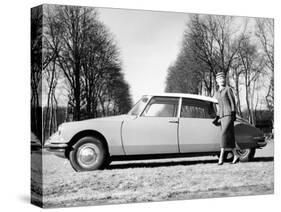 Model with a 1957 Citroën Id 19, C1957-null-Stretched Canvas