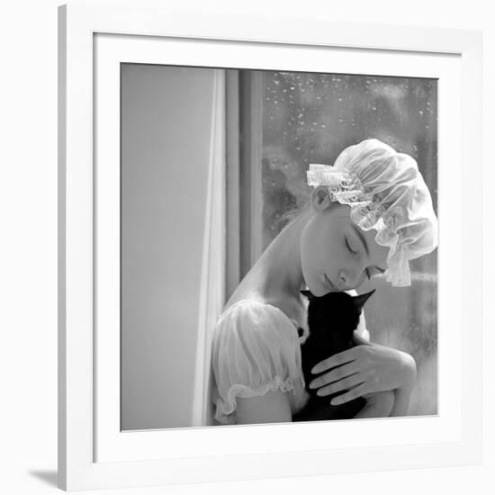 Model with Cap Embracing a Cat, 1960s-John French-Framed Giclee Print