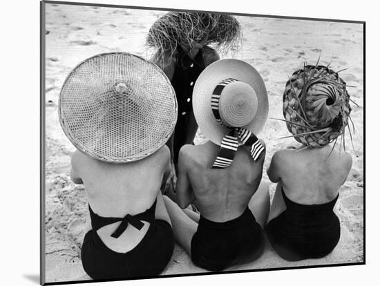 Models on Beach Wearing Different Designs of Straw Hats-Nina Leen-Mounted Photographic Print