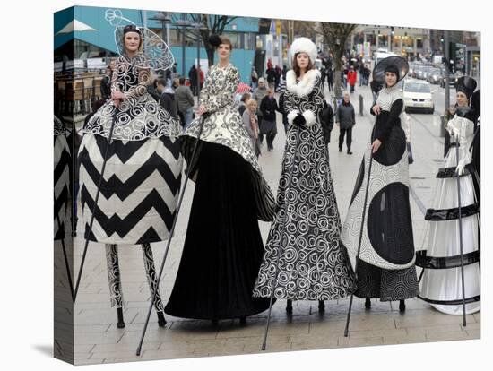 Models on Stilts Present "High Fashion" on the Famous "Jungfernstieg" Boulevard in Hamburg, Germany-null-Stretched Canvas