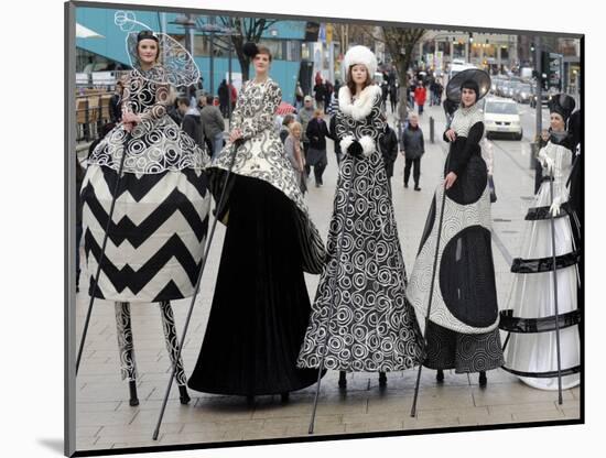 Models on Stilts Present "High Fashion" on the Famous "Jungfernstieg" Boulevard in Hamburg, Germany-null-Mounted Photographic Print