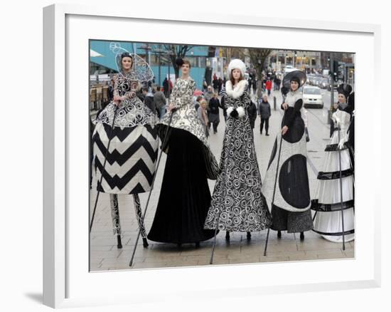 Models on Stilts Present "High Fashion" on the Famous "Jungfernstieg" Boulevard in Hamburg, Germany-null-Framed Photographic Print