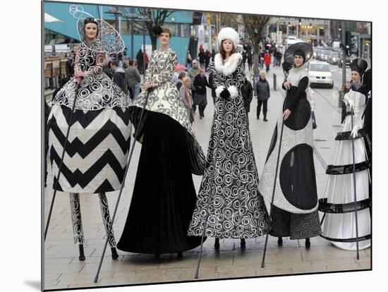 Models on Stilts Present "High Fashion" on the Famous "Jungfernstieg" Boulevard in Hamburg, Germany-null-Mounted Photographic Print