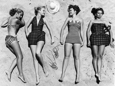 https://imgc.allpostersimages.com/img/posters/models-sunbathing-wearing-latest-beach-fashions_u-L-P3OCBH0.jpg?artPerspective=n