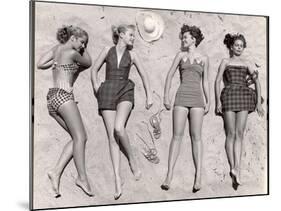 Models Sunbathing, Wearing Latest Beach Fashions-Nina Leen-Mounted Photographic Print