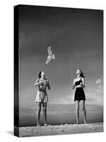 Models Tee Matthews and Bobbie Chambliss Feeding Gulls While Modeling New Bathing Suit Styles-Alfred Eisenstaedt-Stretched Canvas