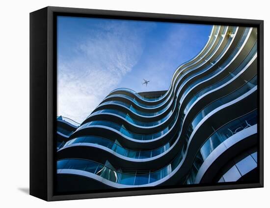 Modern Building with Aeroplane Above-Craig Roberts-Framed Stretched Canvas
