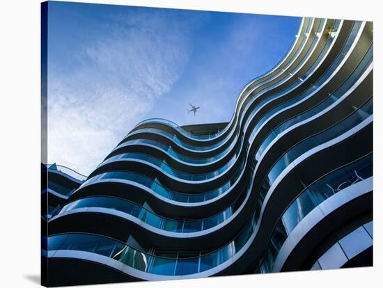 Modern Building with Aeroplane Above-Craig Roberts-Stretched Canvas