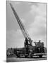 Modern Fire Engine, with Men Raising Ladder Above Truck-null-Mounted Photographic Print