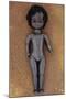 Modern Plastic Black Girl Doll Slightly Scratched and Soiled Lying on Rusty Metal Sheet-Den Reader-Mounted Photographic Print