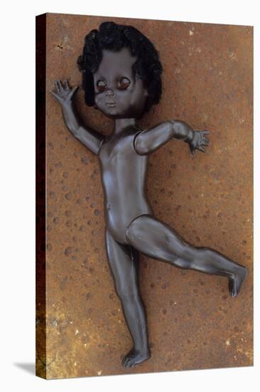 Modern Plastic Black Girl Doll Slightly Scratched and Soiled Lying-Den Reader-Stretched Canvas