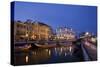 Moliceiro Boats Docked by Art Nouveau Style Buildings along the Central Canal.-Julianne Eggers-Stretched Canvas