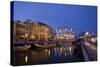 Moliceiro Boats Docked by Art Nouveau Style Buildings along the Central Canal.-Julianne Eggers-Stretched Canvas