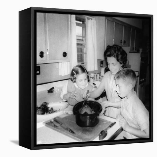 Mom Prepares Dinner with the Kids Watching, Ca. 1962-null-Framed Stretched Canvas