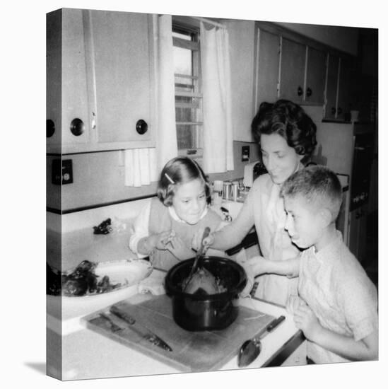 Mom Prepares Dinner with the Kids Watching, Ca. 1962-null-Stretched Canvas