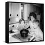 Mom Prepares Dinner with the Kids Watching, Ca. 1962-null-Framed Stretched Canvas