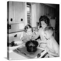 Mom Prepares Dinner with the Kids Watching, Ca. 1962-null-Stretched Canvas