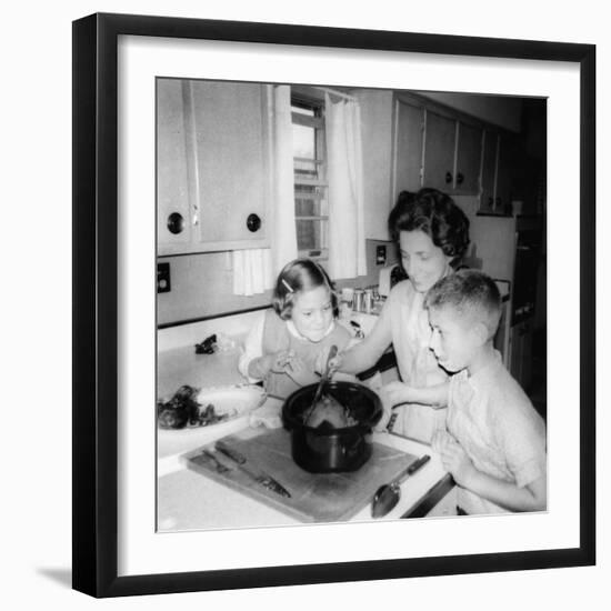 Mom Prepares Dinner with the Kids Watching, Ca. 1962-null-Framed Photographic Print