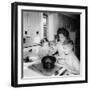 Mom Prepares Dinner with the Kids Watching, Ca. 1962-null-Framed Photographic Print