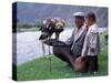 Mongolia, Kasakh Hunter with Eagle by the Khovd River, with a Small Child-Antonia Tozer-Stretched Canvas