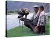 Mongolia, Kasakh Hunter with Eagle by the Khovd River, with a Small Child-Antonia Tozer-Stretched Canvas