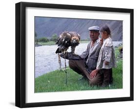 Mongolia, Kasakh Hunter with Eagle by the Khovd River, with a Small Child-Antonia Tozer-Framed Photographic Print