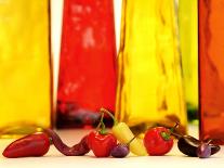 Various Types of Peppers in Front of Red & Yellow Bottles-Monica Varella-Framed Photographic Print