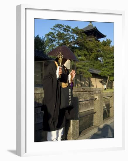 Monk at Toji Temple, Kyoto City, Honshu, Japan-Christian Kober-Framed Photographic Print