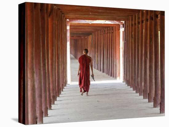 Monk in Walkway of Wooden Pillars To Temple, Salay, Myanmar (Burma)-Peter Adams-Stretched Canvas