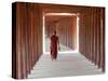 Monk in Walkway of Wooden Pillars To Temple, Salay, Myanmar (Burma)-Peter Adams-Stretched Canvas