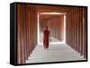 Monk in Walkway of Wooden Pillars To Temple, Salay, Myanmar (Burma)-Peter Adams-Framed Stretched Canvas