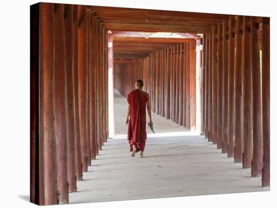 Monk in Walkway of Wooden Pillars To Temple, Salay, Myanmar (Burma)-Peter Adams-Stretched Canvas