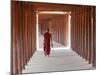 Monk in Walkway of Wooden Pillars To Temple, Salay, Myanmar (Burma)-Peter Adams-Mounted Photographic Print