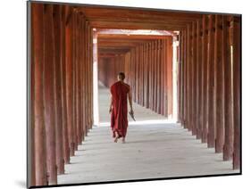 Monk in Walkway of Wooden Pillars To Temple, Salay, Myanmar (Burma)-Peter Adams-Mounted Photographic Print